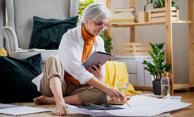 woman in black shirt sitting on white chair Remote Jobs