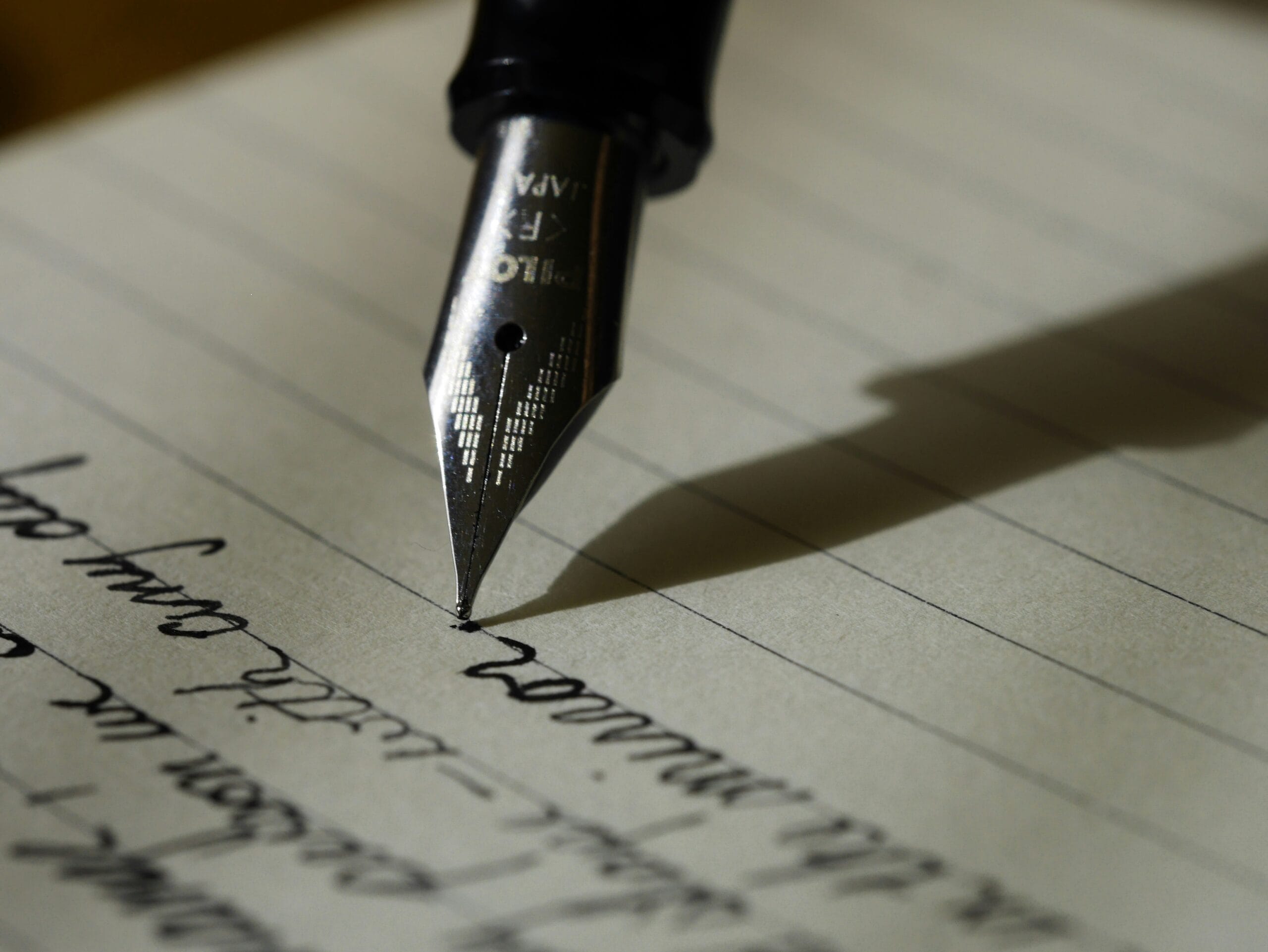 fountain pen on black lined paper My Perfect Resume
